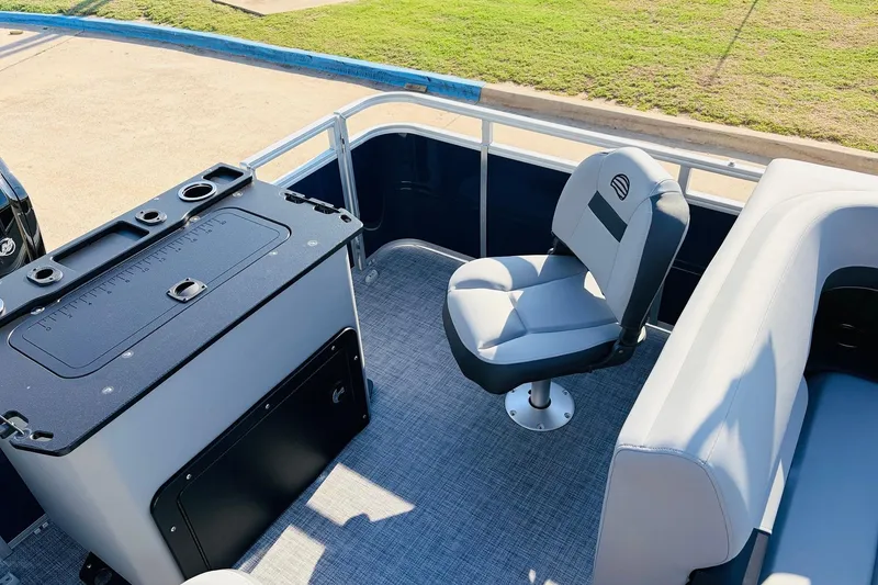 Slide: The Image of 2026 Sun Tracker SportFish 20 DLX boat interior with seating and fishing station. - 39