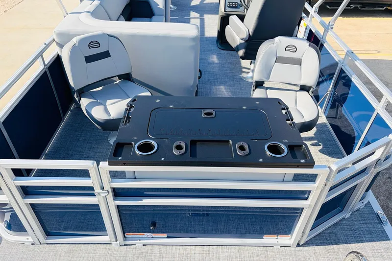 Slide: The Image of 2026 Sun Tracker SportFish 20 DLX pontoon boat interior with seating and table. - 41