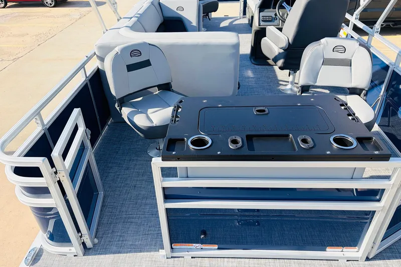 Slide: The Image of 2026 Sun Tracker SportFish 20 DLX pontoon boat interior with seating and fishing station. - 42