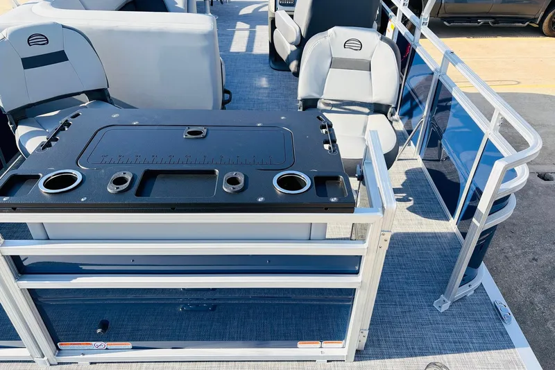 Slide: The Image of 2026 Sun Tracker SportFish 20 DLX pontoon boat interior with seating and fishing station. - 43
