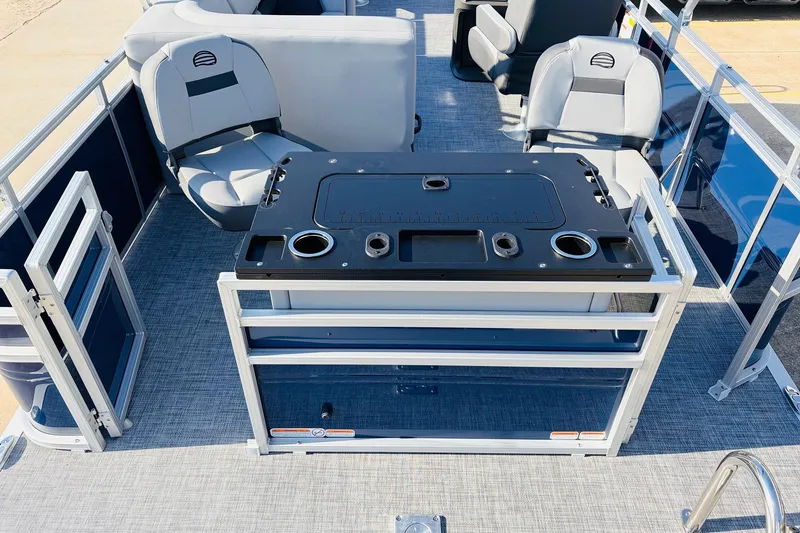 Slide: The Image of 2026 Sun Tracker SportFish 20 DLX pontoon boat interior with seating and fishing station. - 44