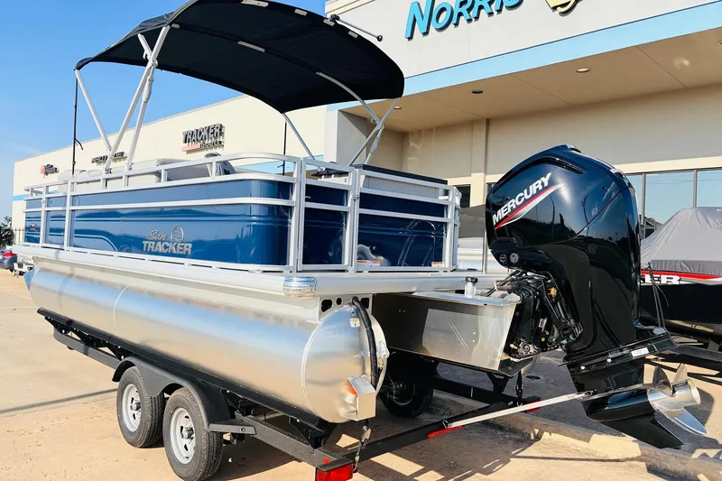 Slide: The Image of 2026 Sun Tracker SportFish 20 DLX pontoon boat with Mercury outboard motor on trailer. - 8