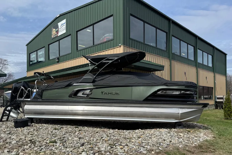 The Image of 2025 Tahoe Pontoon Grand Tahoe LTD Versatile Rear Bench Windshield displayed outside a building. - 0