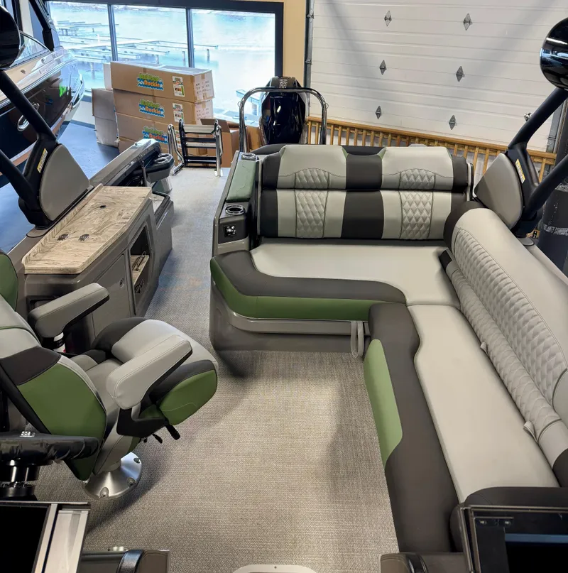 Slide: The Image of 2025 Tahoe Pontoon Grand Tahoe LTD with versatile rear bench and windshield in showroom. - 10