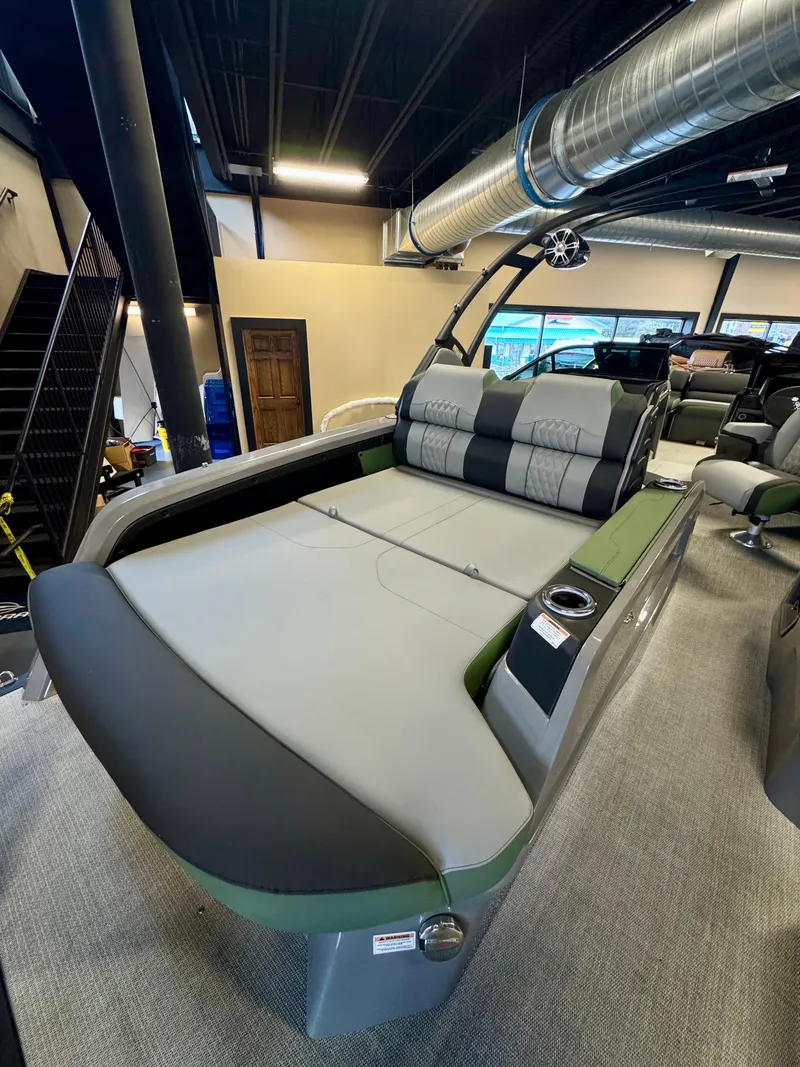 Slide: The Image of 2025 Tahoe Pontoon Grand Tahoe LTD with versatile rear bench and windshield in showroom. - 3