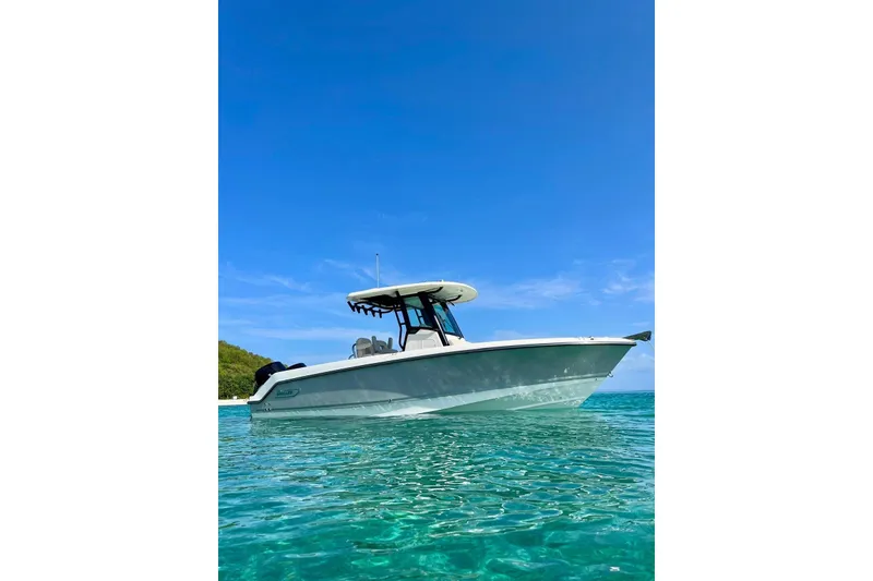 The Image of 2023 Boston Whaler 250 Outrage boat on clear blue water under a sunny sky. - 0