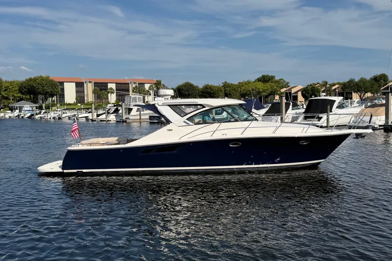 The Image of 2013 Tiara Yachts 3600 Coronet in marina, sleek design, blue hull, sunny day. - 0