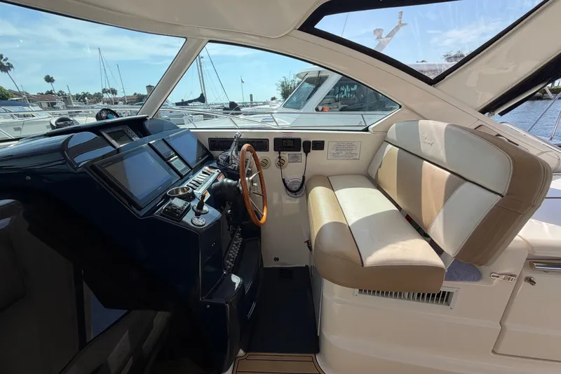 Slide: The Image of Interior of 2013 Tiara Yachts 3600 Coronet, featuring helm and seating area. - 14