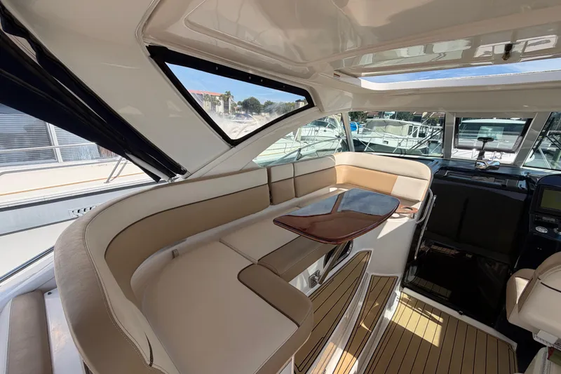 Slide: The Image of Luxurious interior of 2013 Tiara Yachts 3600 Coronet with elegant seating and table. - 16
