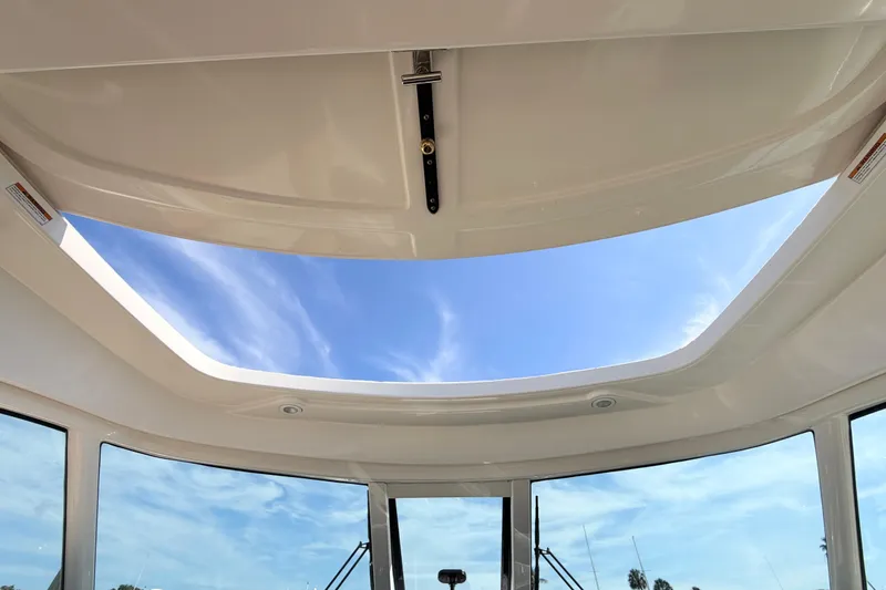 Slide: The Image of Sunroof view from 2013 Tiara Yachts 3600 Coronet, showcasing clear blue sky. - 25