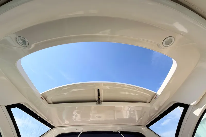 Slide: The Image of Tiara Yachts 3600 Coronet 2013 model with open sunroof against blue sky. - 26