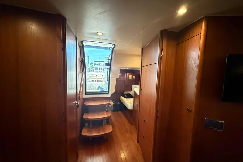 Slide: The Image of Interior of 2013 Tiara Yachts 3600 Coronet with wooden cabinetry and seating area. - 28