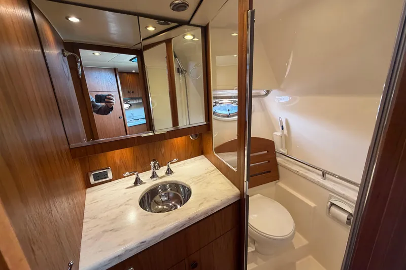 Slide: The Image of Luxurious bathroom in 2013 Tiara Yachts 3600 Coronet with wood accents and modern fixtures. - 37