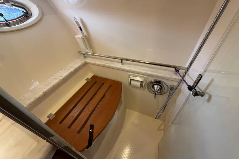 Slide: The Image of Bathroom interior of 2013 Tiara Yachts 3600 Coronet with wooden seat and shower. - 39