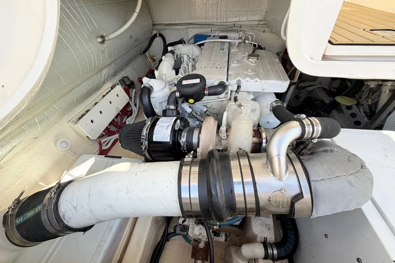 Slide: The Image of Engine compartment of a 2013 Tiara Yachts 3600 Coronet, showcasing detailed mechanical components. - 50