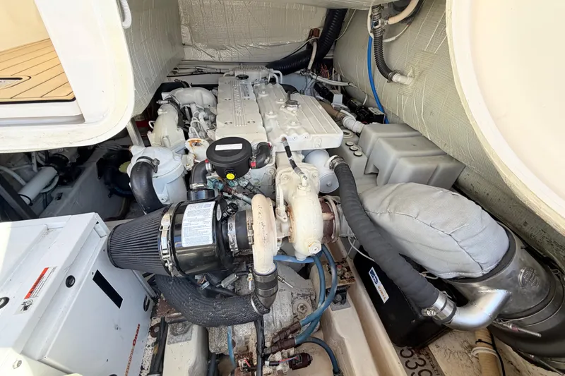 Slide: The Image of Engine compartment of a 2013 Tiara Yachts 3600 Coronet, showcasing detailed mechanical components. - 51