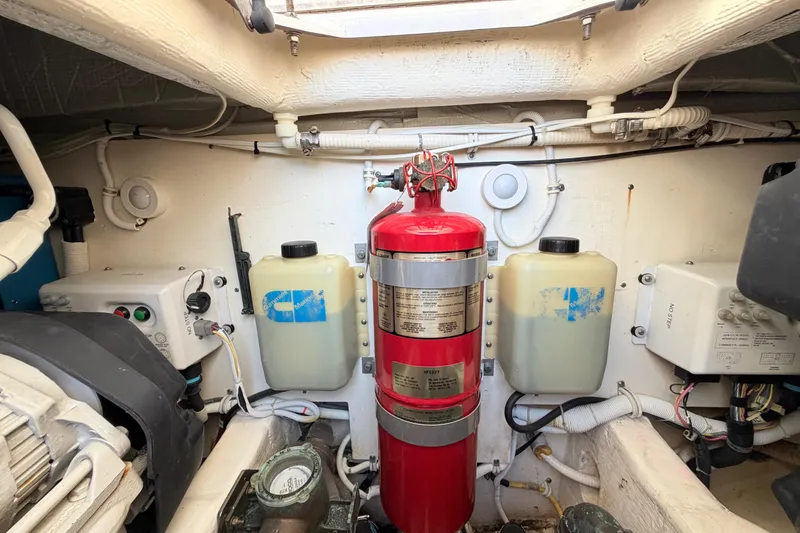 Slide: The Image of Engine room of 2013 Tiara Yachts 3600 Coronet with fire extinguisher and equipment. - 54