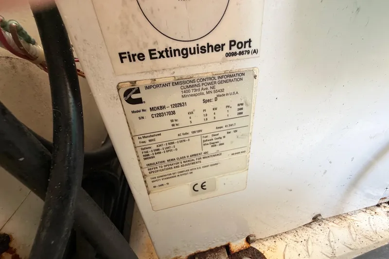 Slide: The Image of Label on Cummins generator in 2013 Tiara Yachts 3600 Coronet, showing emissions and specifications. - 56