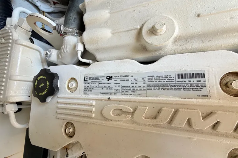 Slide: The Image of Engine compartment of a 2013 Tiara Yachts 3600 Coronet, featuring Cummins diesel engine details. - 57