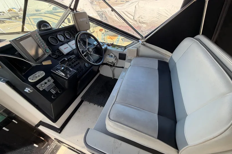 Slide: The Image of Interior cockpit of 1989 Wellcraft 3400 Gran Sport boat with steering wheel and controls. - 12