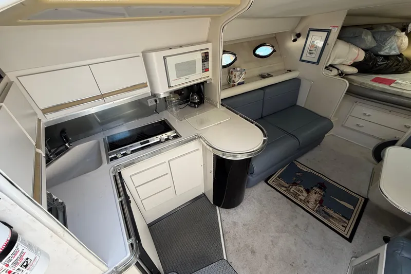 Slide: The Image of Interior of 1989 Wellcraft 3400 Gran Sport yacht with kitchenette and seating area. - 15