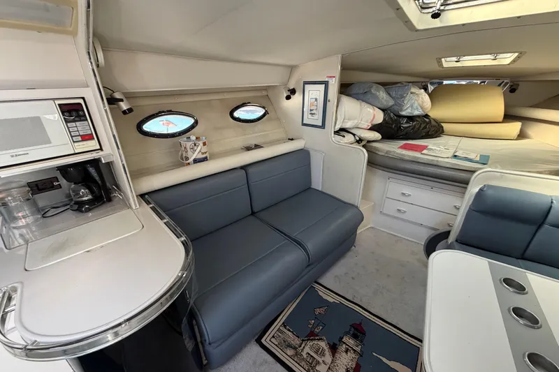Slide: The Image of Interior of 1989 Wellcraft 3400 Gran Sport boat with seating, kitchenette, and sleeping area. - 17