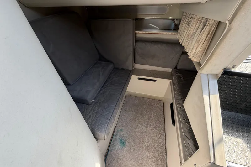 Slide: The Image of Interior cabin of 1989 Wellcraft 3400 Gran Sport with gray seating and carpet. - 19