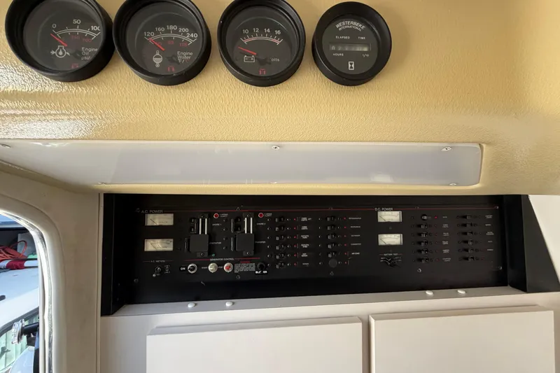 Slide: The Image of Control panel of a 1989 Wellcraft 3400 Gran Sport boat with gauges and switches. - 21