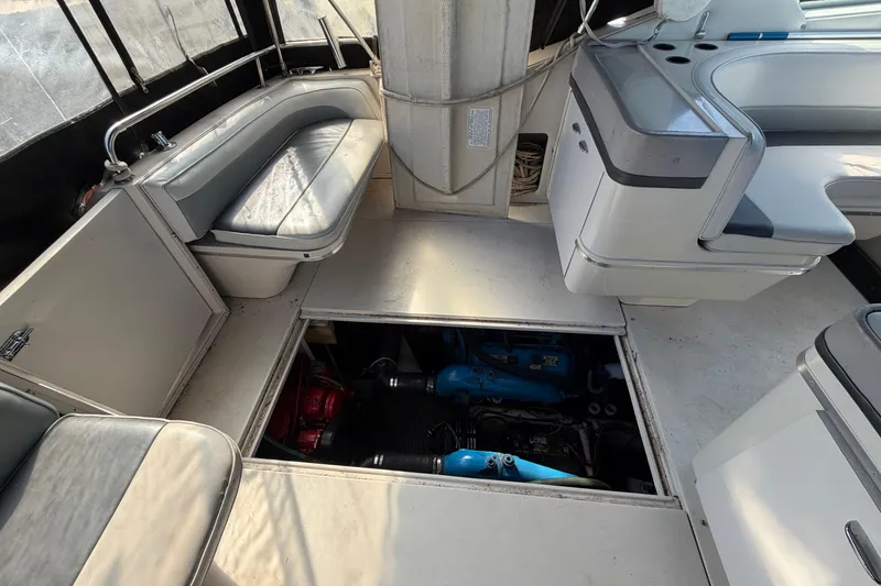Slide: The Image of 1989 Wellcraft 3400 Gran Sport boat interior with open engine compartment. - 9