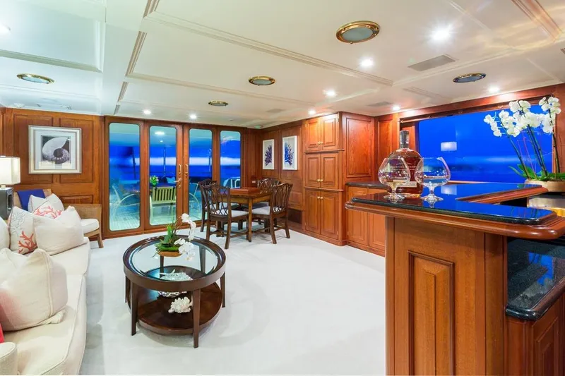 Slide: The Image of Luxurious 1997 Palmer Johnson yacht interior with elegant wood finishes and ocean views. - 18