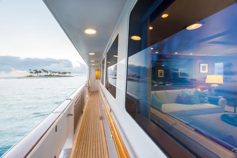 Slide: The Image of Luxurious 1997 Palmer Johnson Semi-Displacement yacht deck with ocean view and island in background. - 23