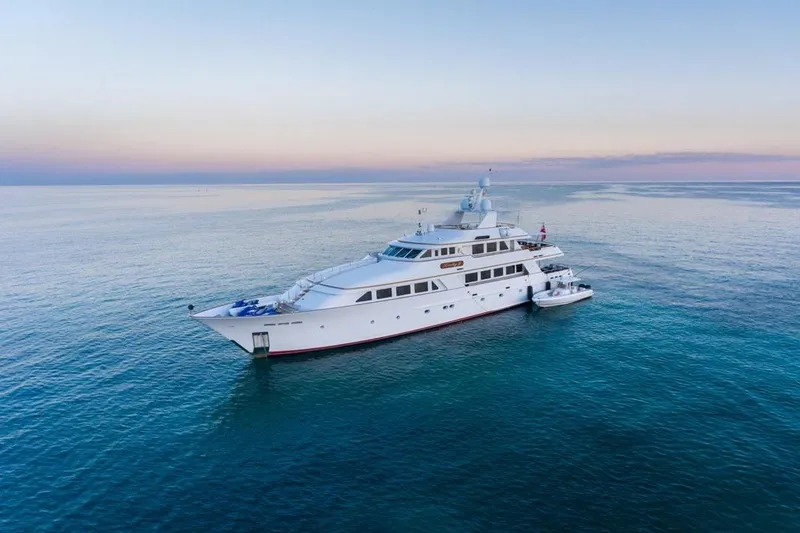 Slide: The Image of Luxurious 1997 Palmer Johnson Semi-Displacement yacht on serene ocean at sunset. - 31