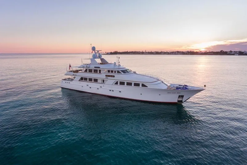 Slide: The Image of Luxurious 1997 Palmer Johnson Semi-Displacement yacht cruising at sunset on calm waters. - 32