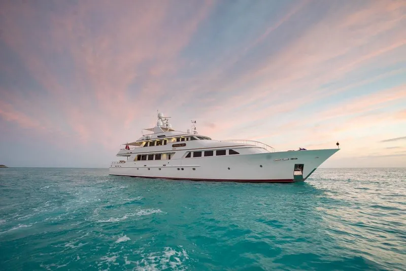 Slide: The Image of Luxurious 1997 Palmer Johnson Semi-Displacement yacht cruising on serene ocean at sunset. - 34