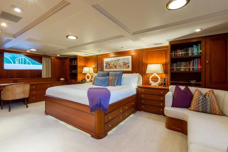 Slide: The Image of Luxurious 1997 Palmer Johnson yacht bedroom with elegant wood furnishings and cozy decor. - 8