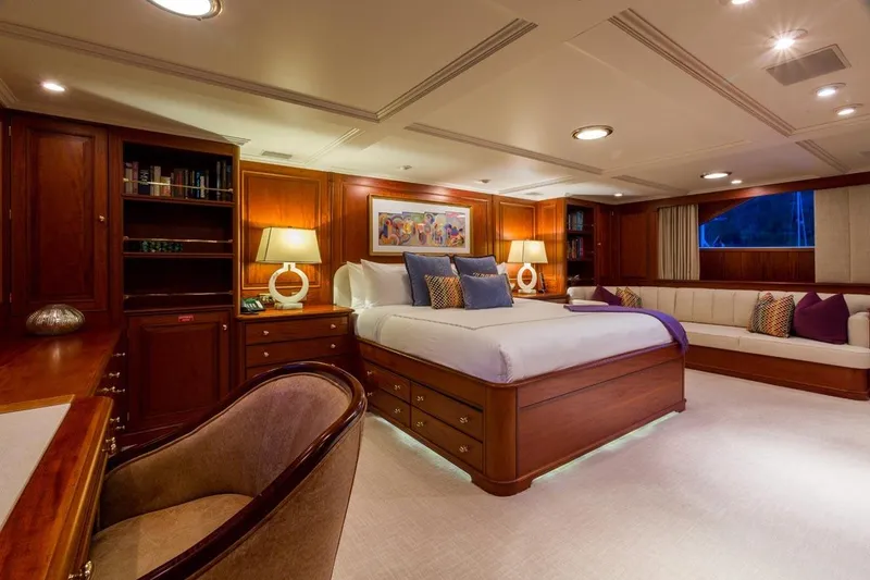 Slide: The Image of Luxurious 1997 Palmer Johnson yacht bedroom with elegant wood furnishings and ambient lighting. - 9
