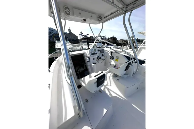 Slide: The Image of 2006 Pro-Line 21 Walkaround boat interior with steering console and seating. - 9