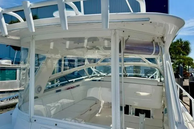 Slide: The Image of 2013 Intrepid 430 Sport Yacht with sleek white interior and spacious seating area. - 14
