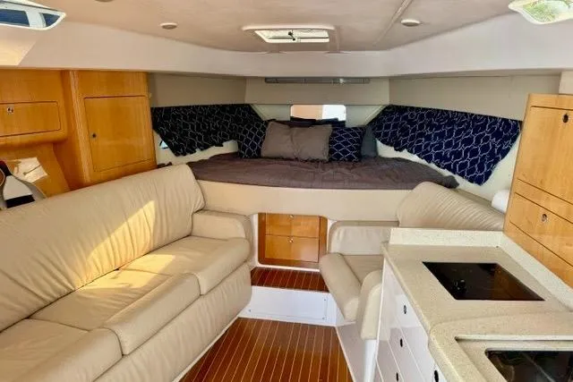 Slide: The Image of Luxurious interior of a 2013 Intrepid 430 Sport Yacht with cozy seating and modern amenities. - 28