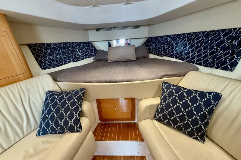 Slide: The Image of Luxurious interior of 2013 Intrepid 430 Sport Yacht with cozy seating and elegant bedding. - 29