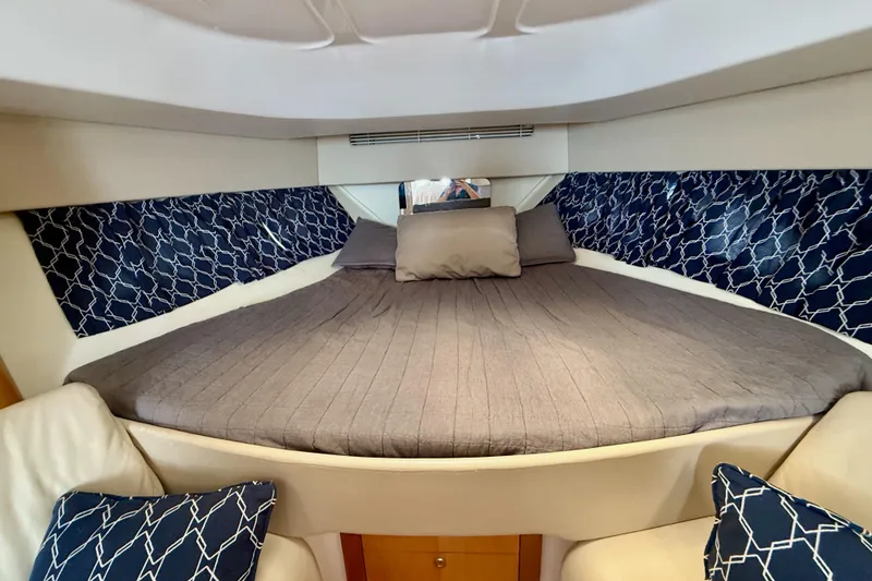 Slide: The Image of Luxurious cabin interior of a 2013 Intrepid 430 Sport Yacht with elegant bedding. - 30