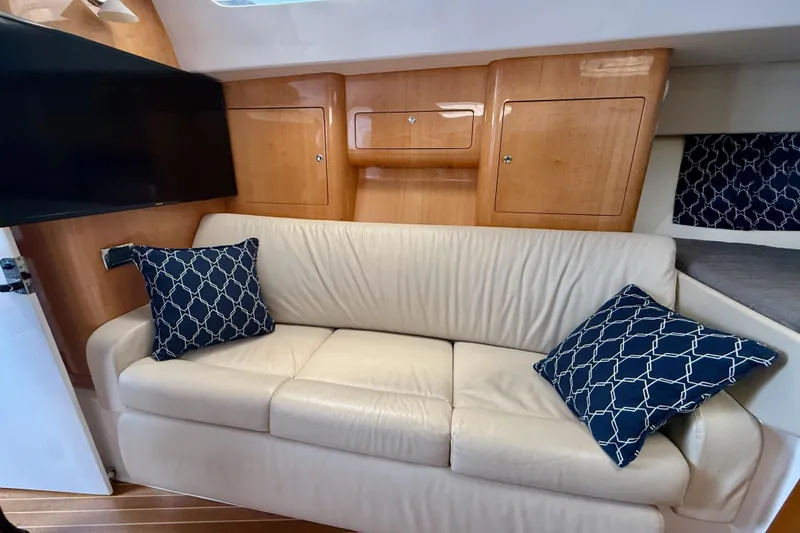 Slide: The Image of Luxurious interior of 2013 Intrepid 430 Sport Yacht with cream sofa and patterned cushions. - 31