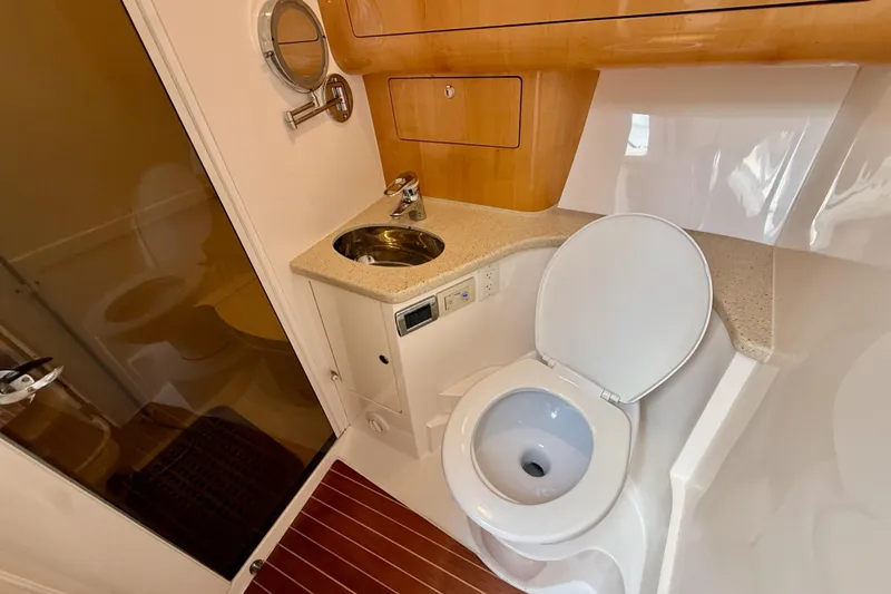 Slide: The Image of Bathroom interior of 2013 Intrepid 430 Sport Yacht with sink and toilet. - 34