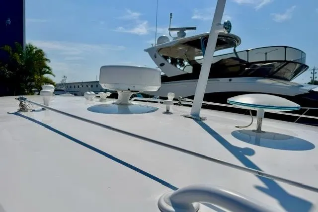 Slide: The Image of 2013 Intrepid 430 Sport Yacht docked under clear blue sky. - 7