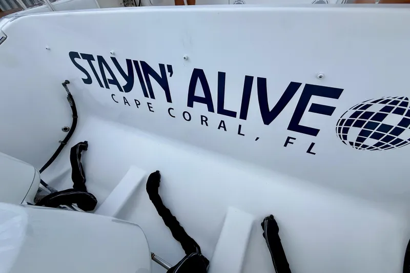 Slide: The Image of 2013 Intrepid 430 Sport Yacht with "Stayin' Alive" text, Cape Coral, FL. - 8