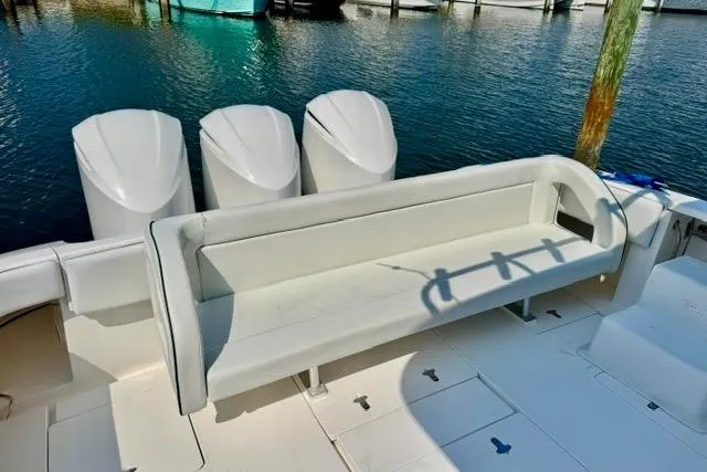 Slide: The Image of 2013 Intrepid 430 Sport Yacht with triple outboard engines and spacious seating area. - 9