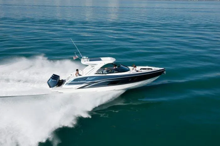 Slide: The Image of 2026 Formula 360 Crossover Bowrider OB cruising swiftly on the water. - 11