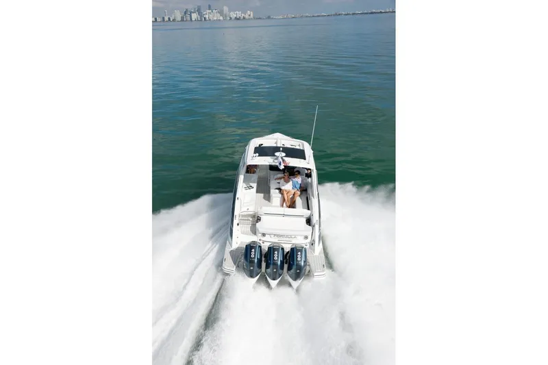 Slide: The Image of 2026 Formula 360 Crossover Bowrider OB on water with city skyline background. - 12