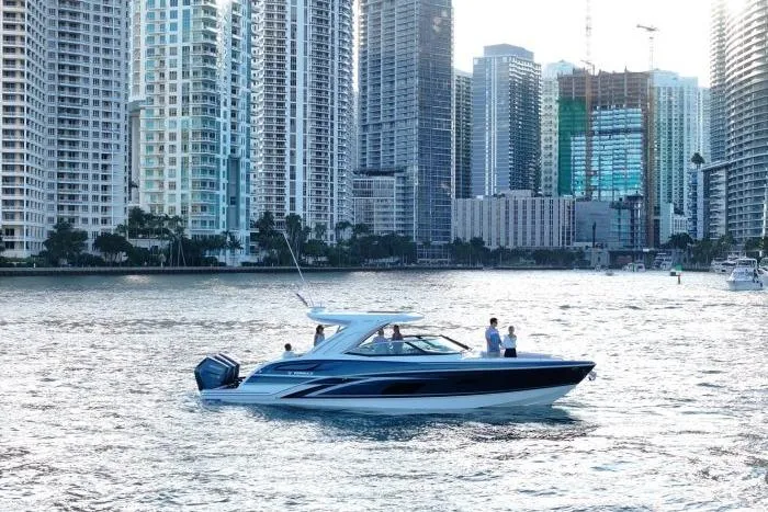 Slide: The Image of 2026 Formula 360 Crossover Bowrider OB in urban waterfront setting. - 13