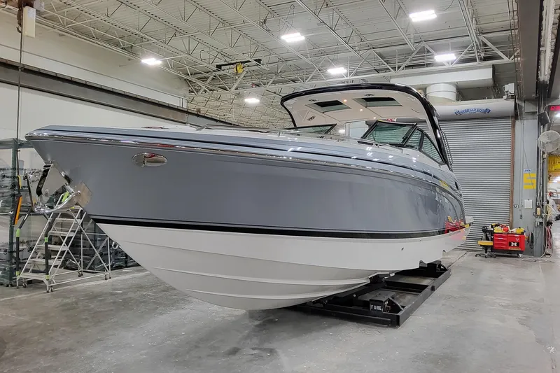Slide: The Image of 2026 Formula 360 Crossover Bowrider OB in a showroom, showcasing sleek design and modern features. - 4